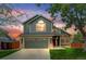 Charming two-story home featuring an attached garage, well-maintained lawn, and vibrant landscaping at 6735 W 97Th Cir, Westminster, CO 80021