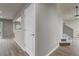 Hallway view with access to an upstairs staircase and view into other rooms at 6735 W 97Th Cir, Westminster, CO 80021