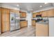 Modern kitchen with stainless steel appliances, granite countertops, and ample cabinet space at 6735 W 97Th Cir, Westminster, CO 80021