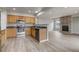 An updated kitchen with stainless steel appliances and eat-in breakfast bar at 6735 W 97Th Cir, Westminster, CO 80021