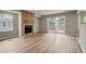 A spacious living room with a brick fireplace and sliding door access to a deck at 6735 W 97Th Cir, Westminster, CO 80021