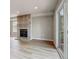 Living room with brick fireplace and sliding glass doors to the outside deck at 6735 W 97Th Cir, Westminster, CO 80021