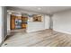 Open concept living room featuring wood grain flooring that extends to kitchen at 6735 W 97Th Cir, Westminster, CO 80021