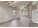 Vaulted living room bathed in natural light with sleek flooring and modern ceiling fan at 6735 W 97Th Cir, Westminster, CO 80021