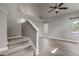 Open floor plan view of carpeted stairs leading to upper floor with natural light throughout at 6735 W 97Th Cir, Westminster, CO 80021