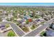 Aerial view of a home in a residential neighborhood with tree-lined streets and well-maintained yards at 12978 Dexter St, Thornton, CO 80241