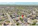 Charming neighborhood aerial view with mountain views in the distance in a serene suburban setting with mature trees at 12978 Dexter St, Thornton, CO 80241