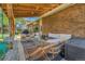 Backyard patio with cozy seating, grill, and outdoor lighting, perfect for entertaining at 12978 Dexter St, Thornton, CO 80241