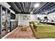 Finished basement features a stylish wet bar, comfortable seating, and a work out space at 12978 Dexter St, Thornton, CO 80241