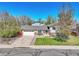 Charming home with well-maintained lawn, driveway, and attached garage, offering great curb appeal at 12978 Dexter St, Thornton, CO 80241