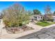 Well-manicured front yard and driveway lead up to this charming home with mature trees at 12978 Dexter St, Thornton, CO 80241