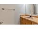 Functional half bathroom with a wood vanity, countertop, and towel bar at 125 S 22Nd Ave # 6, Brighton, CO 80601