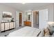 Spacious bedroom featuring neutral walls, plush carpet and ensuite bathroom and shower at 125 S 22Nd Ave # 6, Brighton, CO 80601