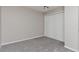Cozy bedroom with neutral walls, plush carpeting, and a spacious closet with sliding doors at 125 S 22Nd Ave # 6, Brighton, CO 80601