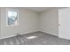 Bedroom featuring plush carpet, neutral walls, and a window at 125 S 22Nd Ave # 6, Brighton, CO 80601