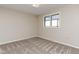 Bright bedroom with plush carpet, neutral walls and a window at 125 S 22Nd Ave # 6, Brighton, CO 80601