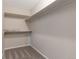 Walk-in closet with carpeted floor and built-in shelving for storage at 125 S 22Nd Ave # 6, Brighton, CO 80601