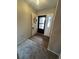 Inviting entryway featuring a black front door with a floral wreath and durable wood-look flooring at 125 S 22Nd Ave # 6, Brighton, CO 80601