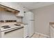 Functional kitchen with vintage appliances, including a classic stove and refrigerator at 125 S 22Nd Ave # 6, Brighton, CO 80601