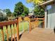 A lovely backyard view from the deck with a manicured lawn and a well-maintained wood fence at 10553 Adams St, Northglenn, CO 80233
