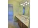 Bathroom with sink, large vanity, and ample counter space located near bedroom at 10553 Adams St, Northglenn, CO 80233