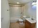 Bathroom with a combination shower and tub, and tile flooring at 10553 Adams St, Northglenn, CO 80233