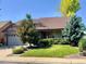Charming single-Gathering home featuring a lush, green lawn and well-maintained landscaping at 10553 Adams St, Northglenn, CO 80233