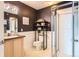 Cozy bathroom featuring a shower, toilet, sink, and shelving unit for added storage and organization at 15475 Andrews Dr # 318, Denver, CO 80239