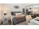 Bedroom with a mirrored closet, bookshelf, desk and decor at 15475 Andrews Dr # 318, Denver, CO 80239