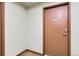 Condominium door with unit number and secure entry features at 15475 Andrews Dr # 318, Denver, CO 80239
