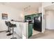 Open kitchen with breakfast bar and seating at 15475 Andrews Dr # 318, Denver, CO 80239