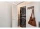 Compact laundry area with stacked washer and dryer, maximizing space for efficient laundry tasks at 15475 Andrews Dr # 318, Denver, CO 80239