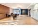 Comfortable lobby with leather chairs, exposed brick accent wall and concrete floors at 15475 Andrews Dr # 318, Denver, CO 80239
