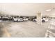 Well-lit parking garage with ample spaces for residents, ensuring convenient vehicle storage and access at 15475 Andrews Dr # 318, Denver, CO 80239