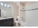 Bathroom featuring a vanity with granite countertops, a bathtub, and a shower at 6634 S Patsburg St, Aurora, CO 80016