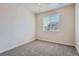 Inviting bedroom offering plush carpeting, neutral walls, and a bright window at 6634 S Patsburg St, Aurora, CO 80016