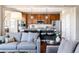 Open-concept kitchen features a large island, stainless steel appliances, and modern fixtures at 9186 Viaggio Way, Highlands Ranch, CO 80126