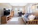 Well-lit home office with desk, futon, and built-in shelves at 9186 Viaggio Way, Highlands Ranch, CO 80126