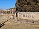 The Tresana community entrance sign is surrounded by mature landscaping at 9186 Viaggio Way, Highlands Ranch, CO 80126
