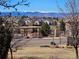 Neighborhood view with mountain backdrop at 9186 Viaggio Way, Highlands Ranch, CO 80126