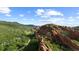 Breathtaking aerial view of the rocky mountain landscape, showcasing the area's natural beauty and tranquility at 3755 N Rampart Range Rd, Littleton, CO 80125