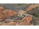 Magnificent home surrounded by a dramatic landscape of imposing red rock formations at 3755 N Rampart Range Rd, Littleton, CO 80125