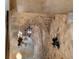 Stone-arched hallway featuring decorative sconces and hanging pendant lights at 3755 N Rampart Range Rd, Littleton, CO 80125