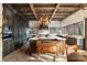 Well-equipped kitchen with dark wood cabinetry, large island and modern appliances at 3755 N Rampart Range Rd, Littleton, CO 80125