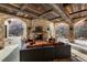 Inviting outdoor living space with stone fireplace, comfortable seating, and scenic views at 3755 N Rampart Range Rd, Littleton, CO 80125