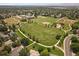 This aerial view showcases a park, baseball fields, playground and walking paths surrounded by neighborhood at 11570 Depew Ct, Westminster, CO 80020
