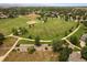 Aerial view showcases a large green community park with baseball field, pathways, trees, and open spaces at 11570 Depew Ct, Westminster, CO 80020