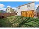 Large backyard with green grass and a wood fence providing privacy at 11570 Depew Ct, Westminster, CO 80020