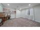 This finished basement features neutral carpet, a window for natural light and shelving for extra storage at 11570 Depew Ct, Westminster, CO 80020