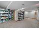 Spacious basement with shelving for organized storage, offering versatility for various needs at 11570 Depew Ct, Westminster, CO 80020